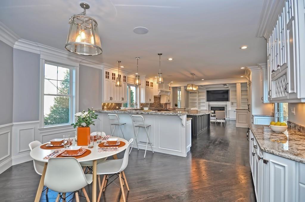 50 Beatrice Way Canton, MA 02021 - Photo 5 of 29 a dining room with furniture a chandelier and wooden floor