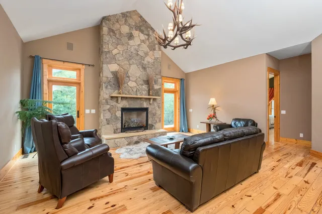 a bedroom with a large bed and a large window