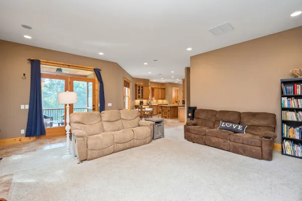 a bathroom with a granite countertop sink toilet and a mirror
