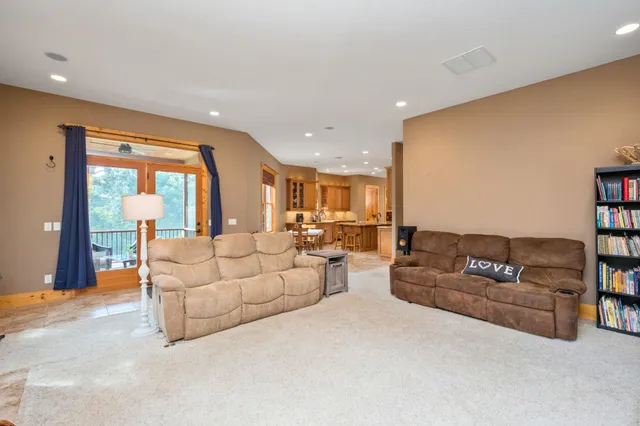 a bathroom with a granite countertop sink a toilet and mirror