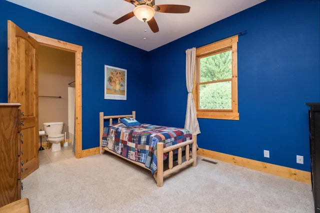 a kitchen with stainless steel appliances granite countertop a sink and dishwasher with wooden floor