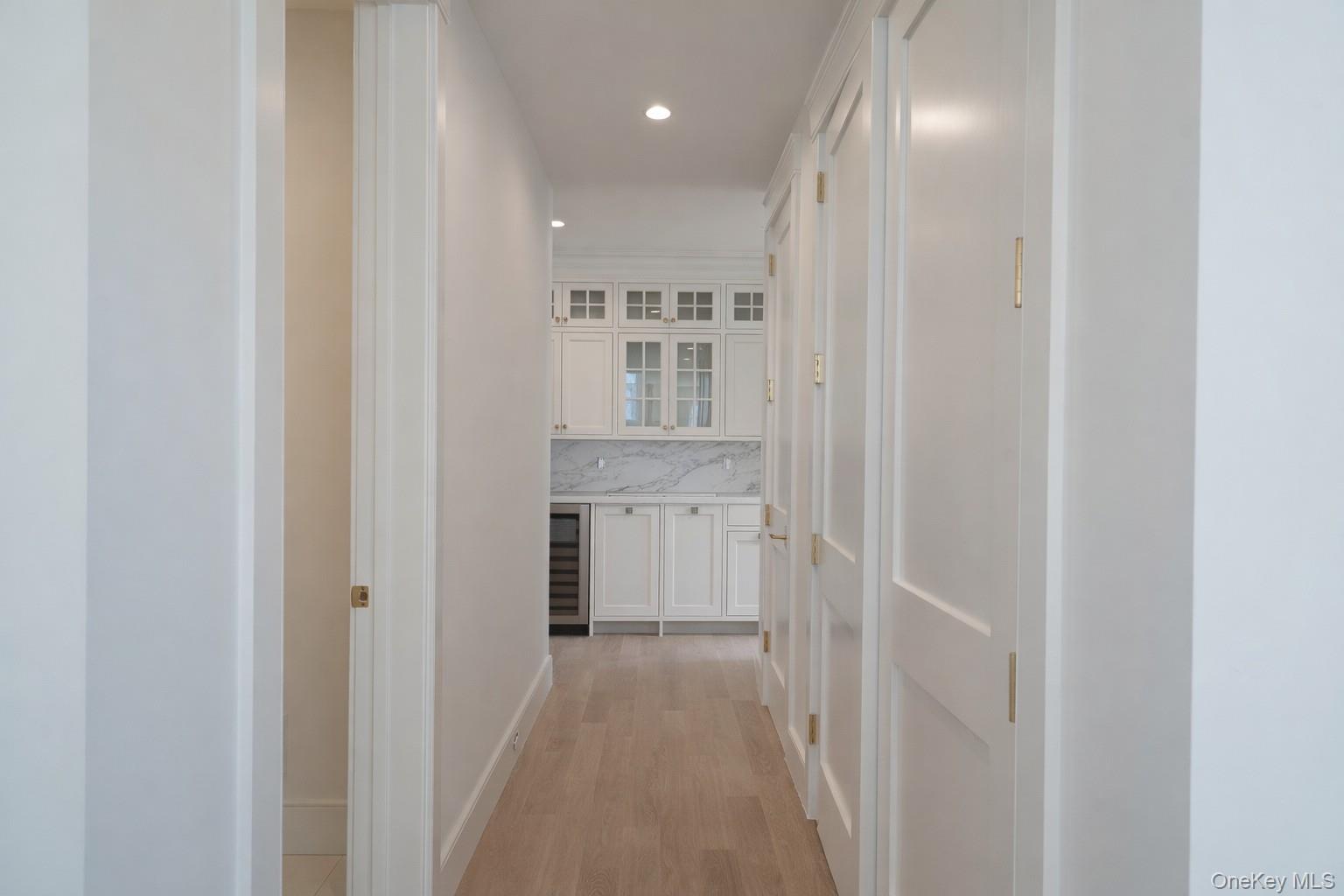 97 Aspatuck Road Westhampton Beach, NY 11978 - Photo 15 of 49 a view of a hallway with white walls