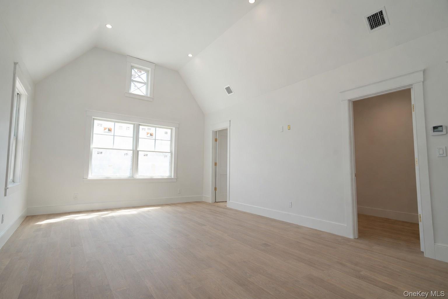 97 Aspatuck Road Westhampton Beach, NY 11978 - Photo 23 of 49 an empty room with a empty space and windows