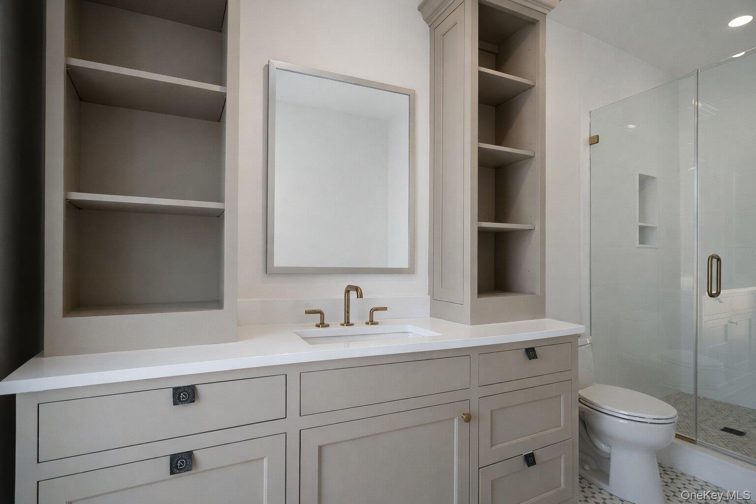 97 Aspatuck Road Westhampton Beach, NY 11978 - Photo 27 of 49 a bathroom with a sink and a toilet
