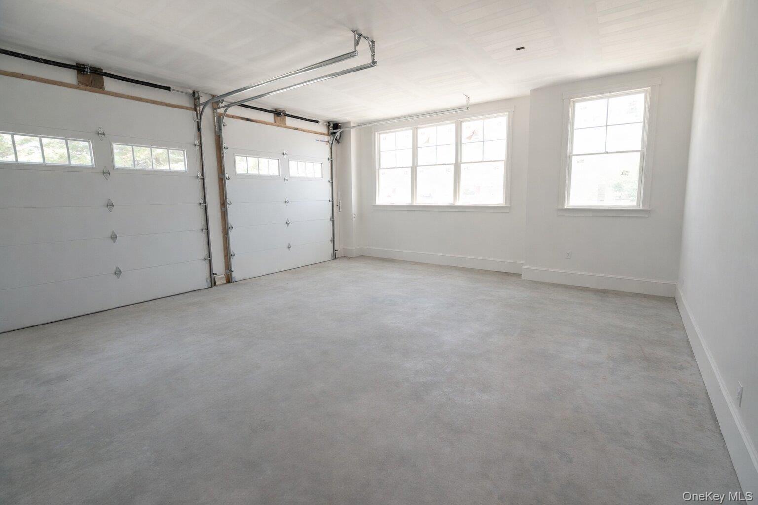 97 Aspatuck Road Westhampton Beach, NY 11978 - Photo 36 of 49 an empty room with windows