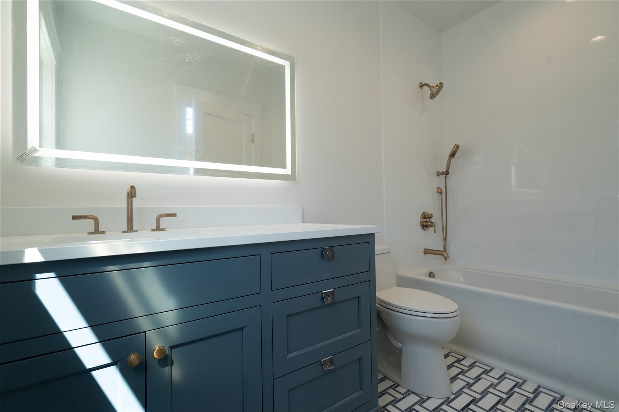 97 Aspatuck Road Westhampton Beach, NY 11978 - Photo 37 of 49 a bathroom with a sink toilet and shower