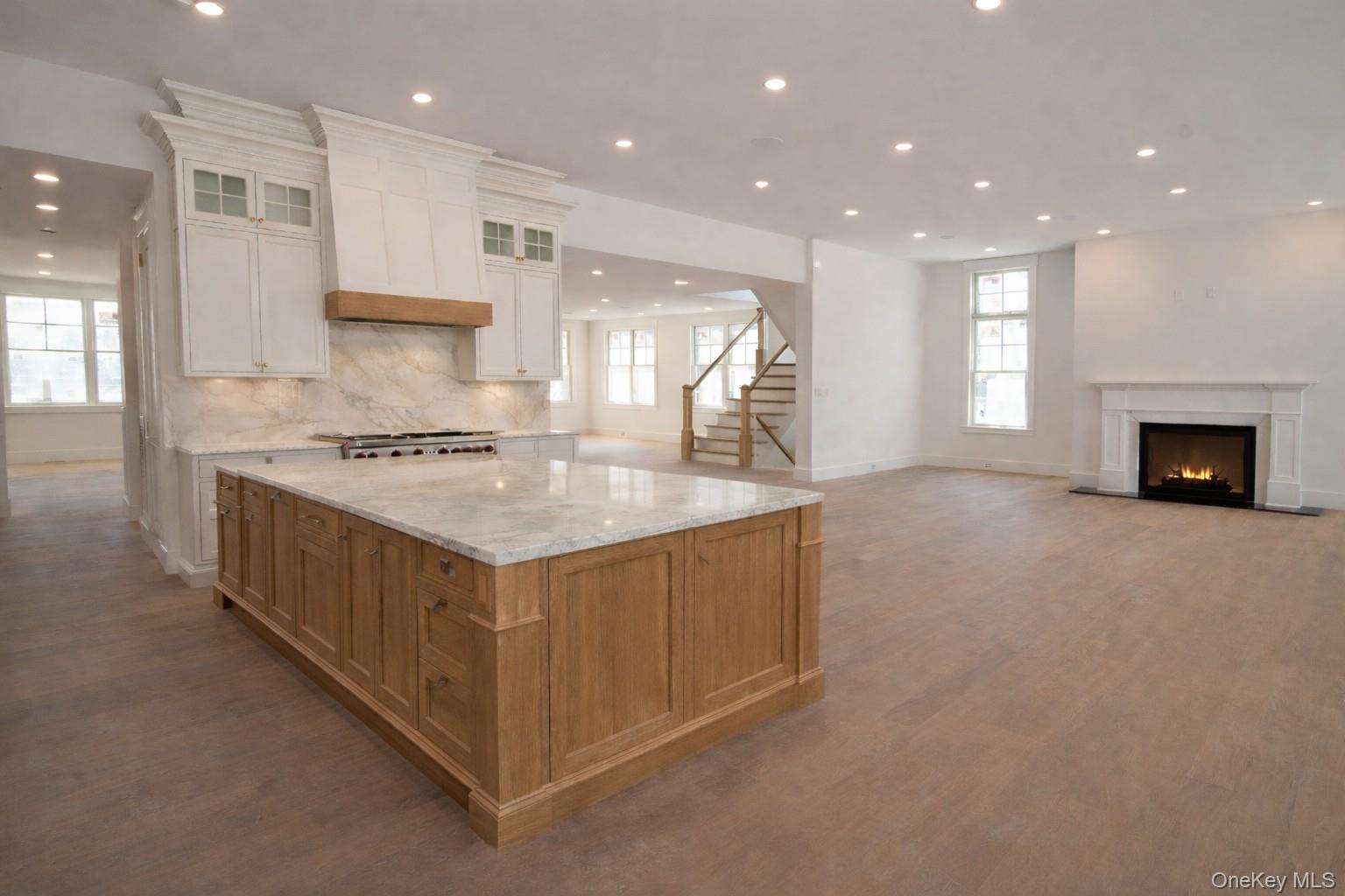 97 Aspatuck Road Westhampton Beach, NY 11978 - Photo 4 of 49 a kitchen with stainless steel appliances granite countertop a stove and a sink