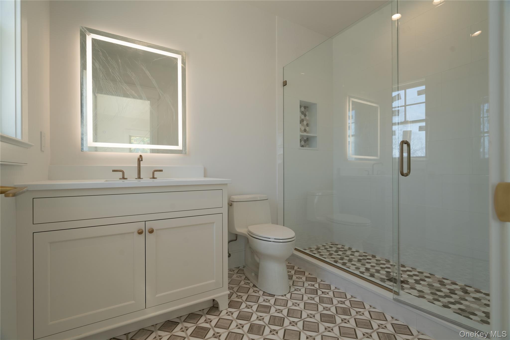 97 Aspatuck Road Westhampton Beach, NY 11978 - Photo 43 of 49 a bathroom with a sink toilet and shower