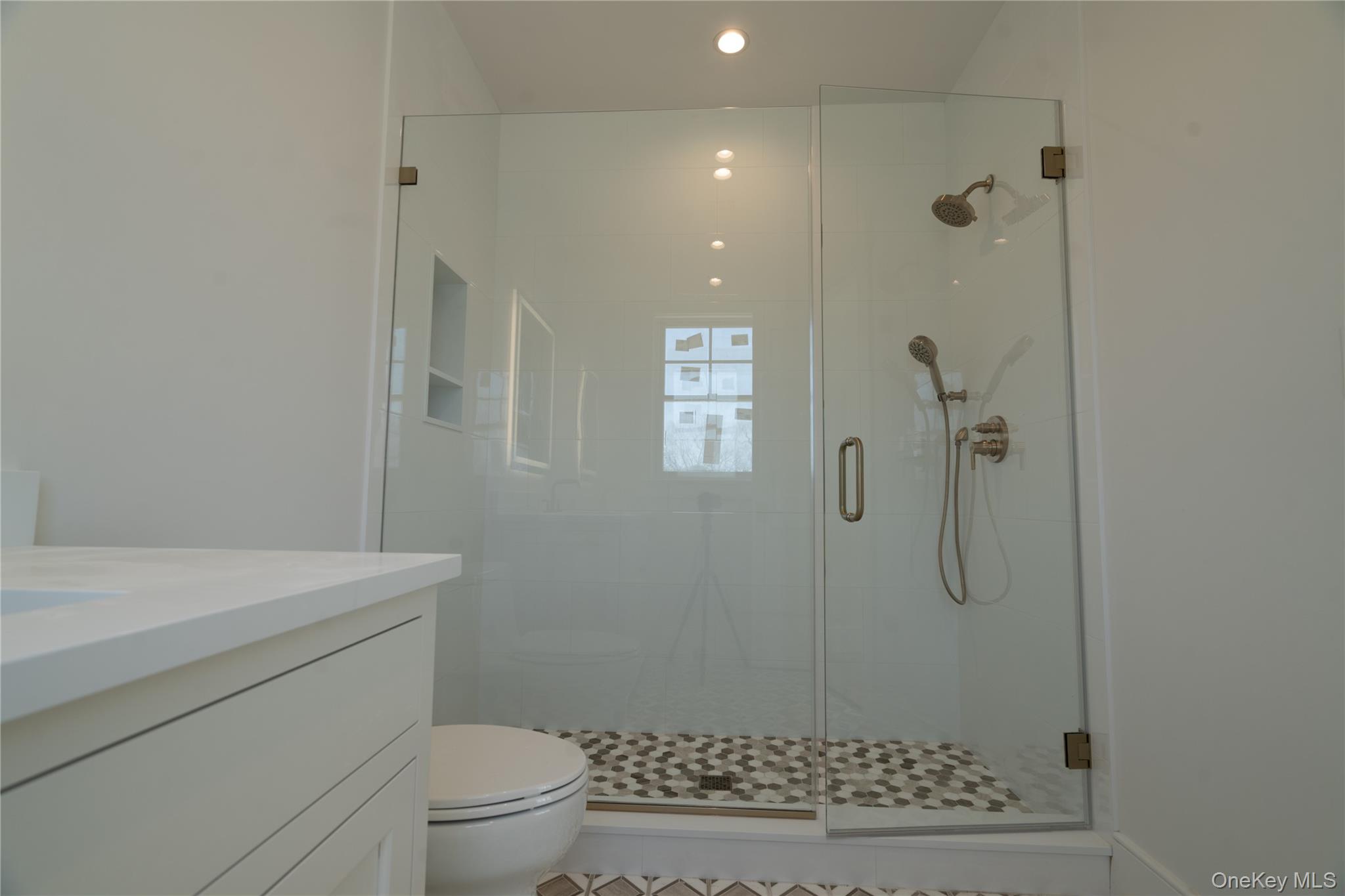 97 Aspatuck Road Westhampton Beach, NY 11978 - Photo 44 of 49 a bathroom with a shower a toilet and a sink