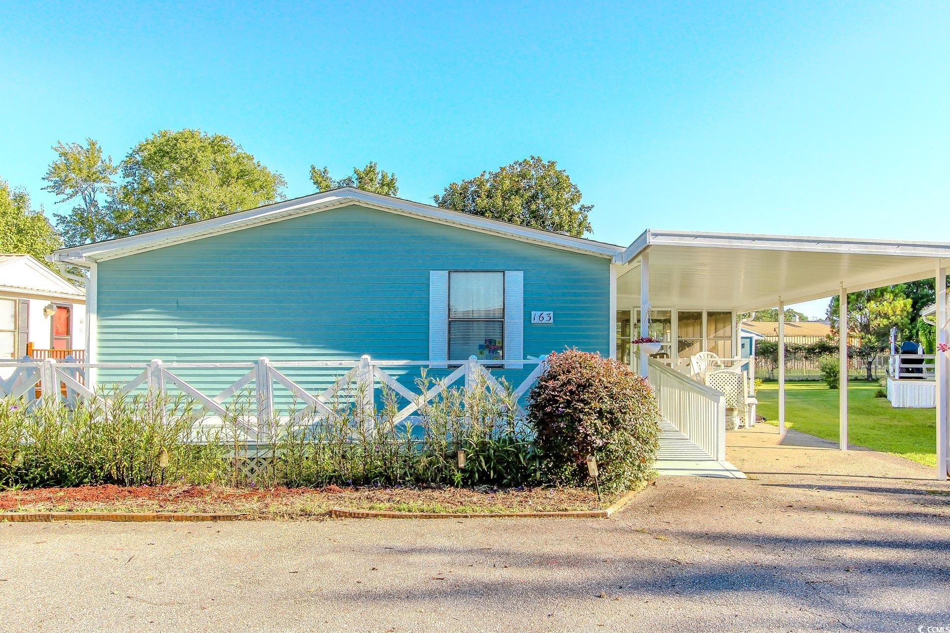 View of home's exterior with a porch