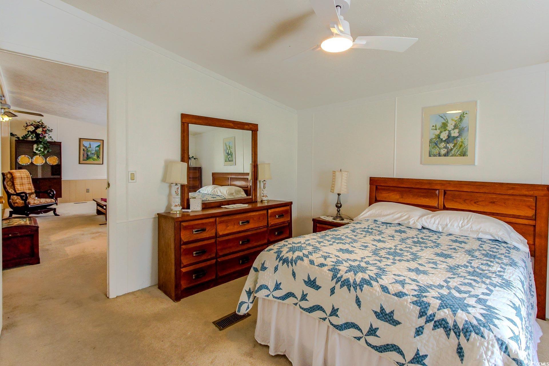 163 Crooked Island Circle Murrells Inlet, SC 29576 - Photo 16 of 40 Bedroom featuring light carpet, vaulted ceiling, ceiling fan, and ornamental molding