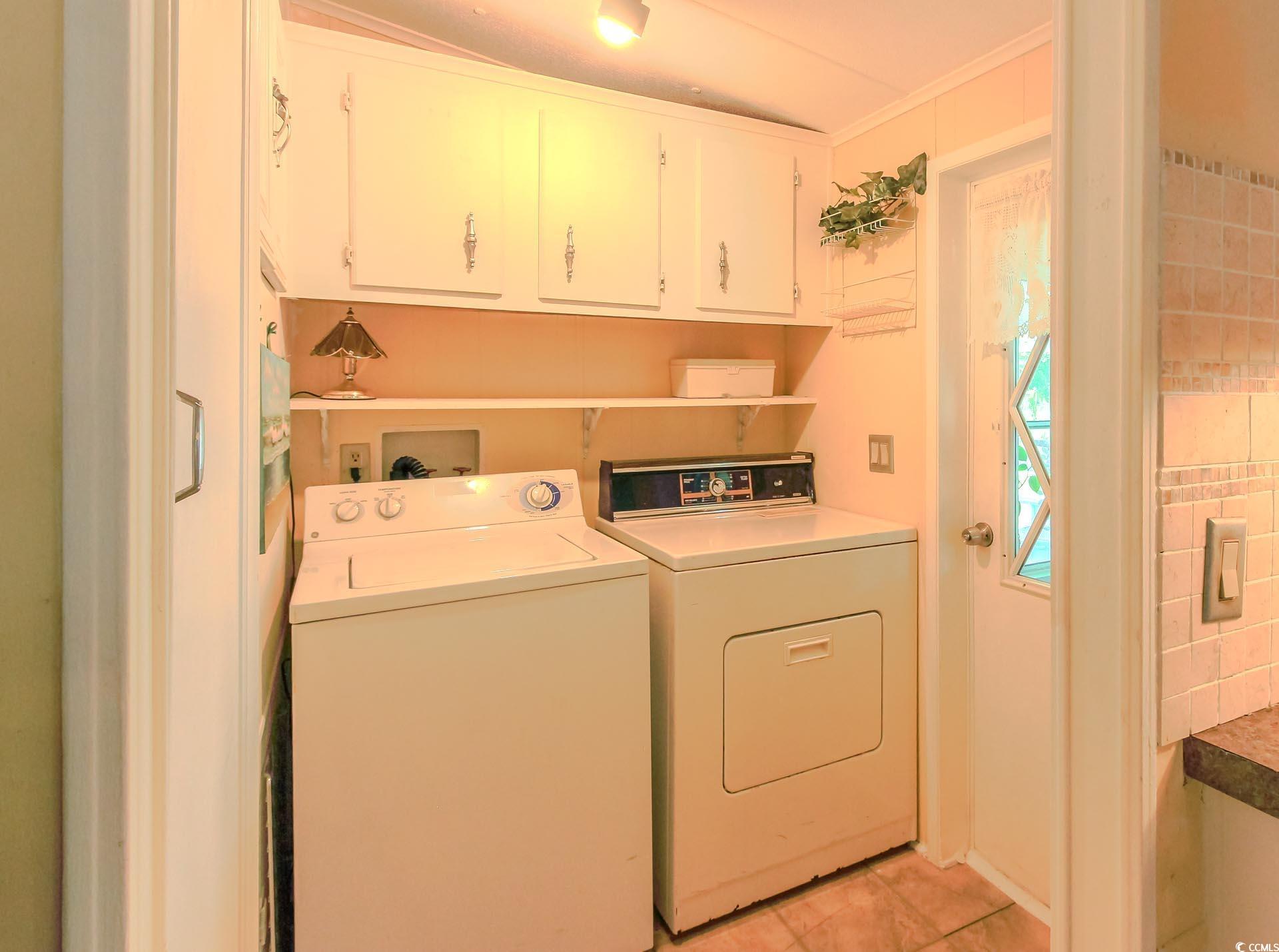 163 Crooked Island Circle Murrells Inlet, SC 29576 - Photo 24 of 40 Washroom with cabinet space, light tile patterned floors, and separate washer and dryer