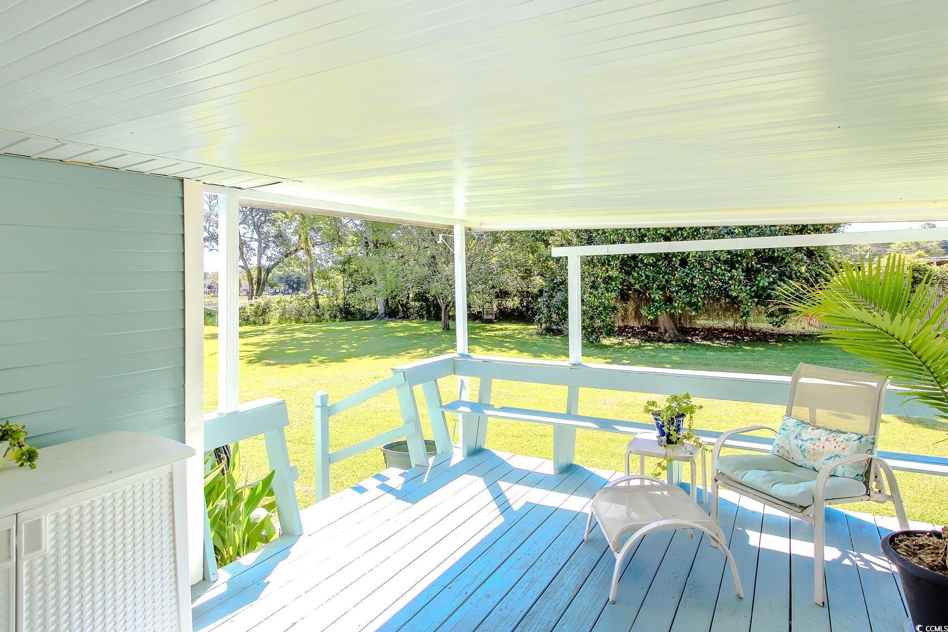 163 Crooked Island Circle Murrells Inlet, SC 29576 - Photo 29 of 40 Wooden deck featuring a lawn