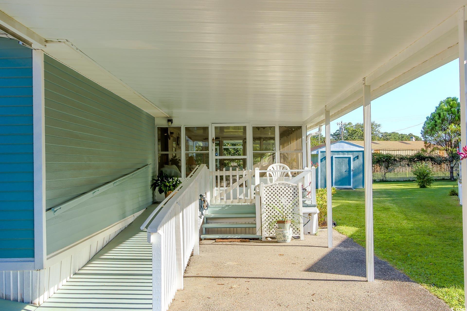 163 Crooked Island Circle Murrells Inlet, SC 29576 - Photo 4 of 40 View of sunroom