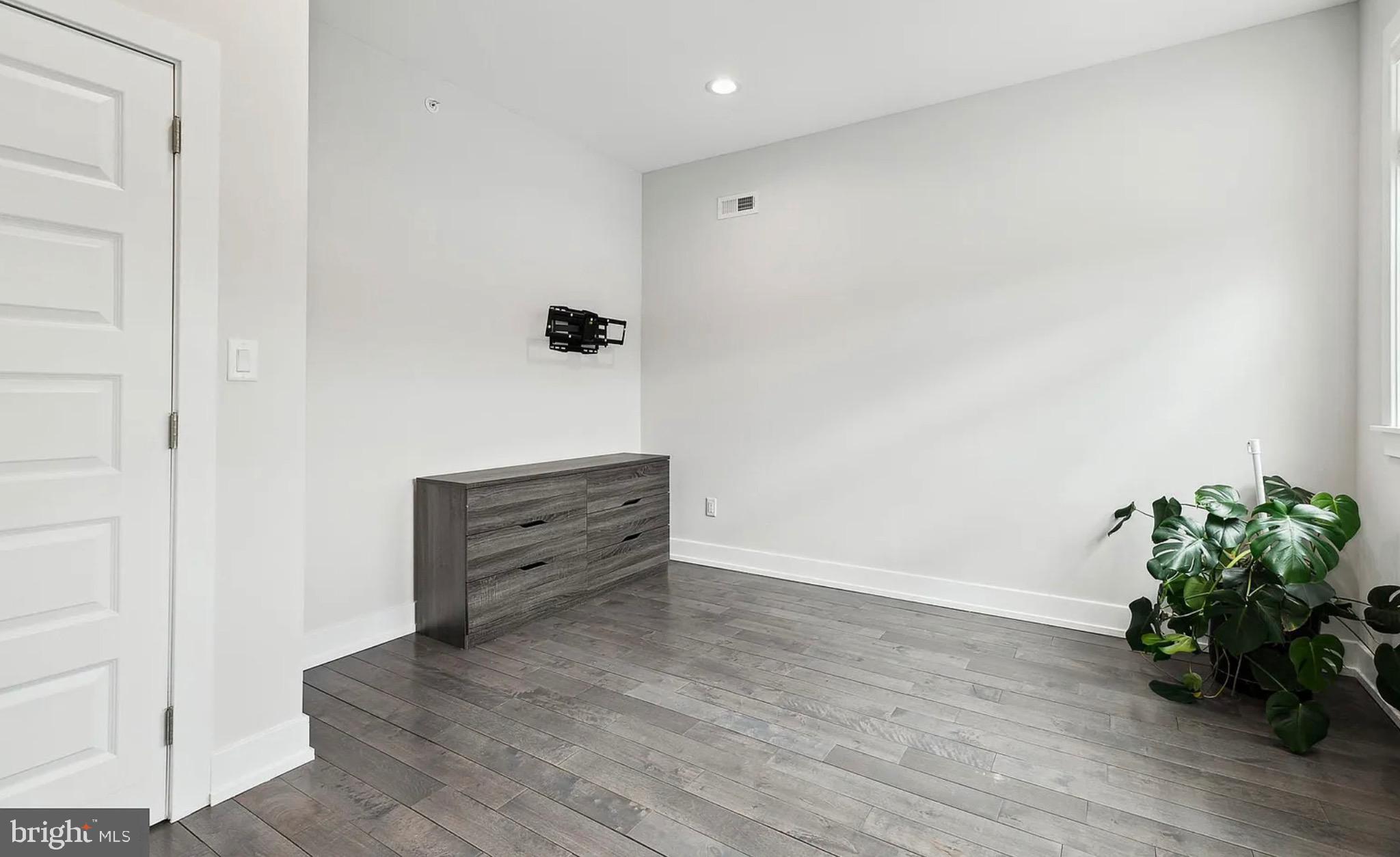 2813 Tilton Street Philadelphia, PA 19134 - Photo 18 of 33 a view of an empty room with wooden floor