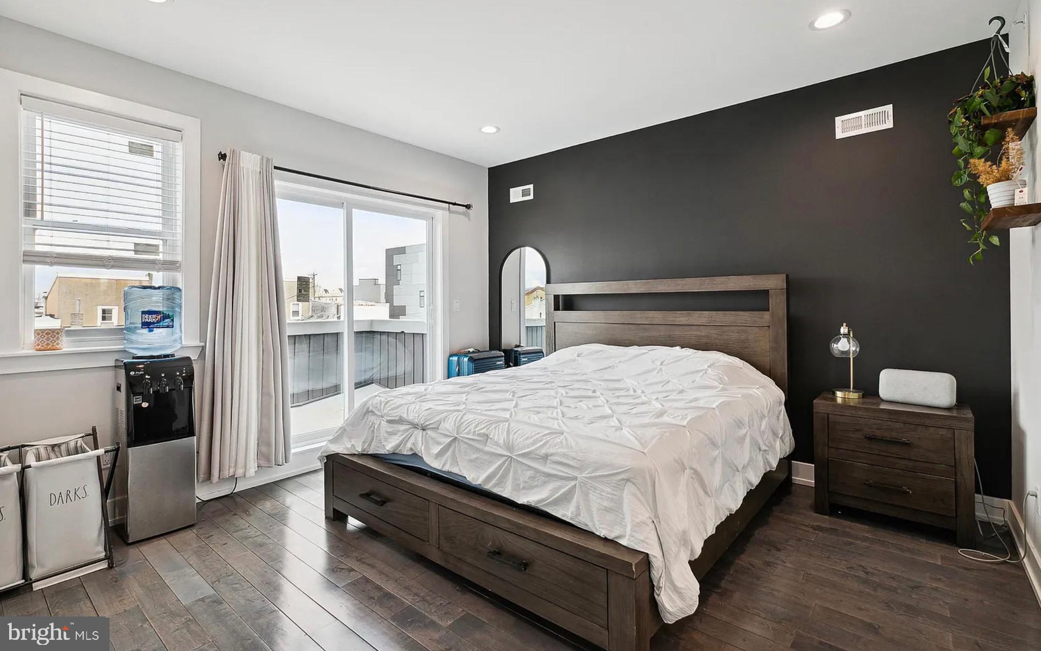 2813 Tilton Street Philadelphia, PA 19134 - Photo 21 of 33 a large bed sitting in a bedroom next to a window