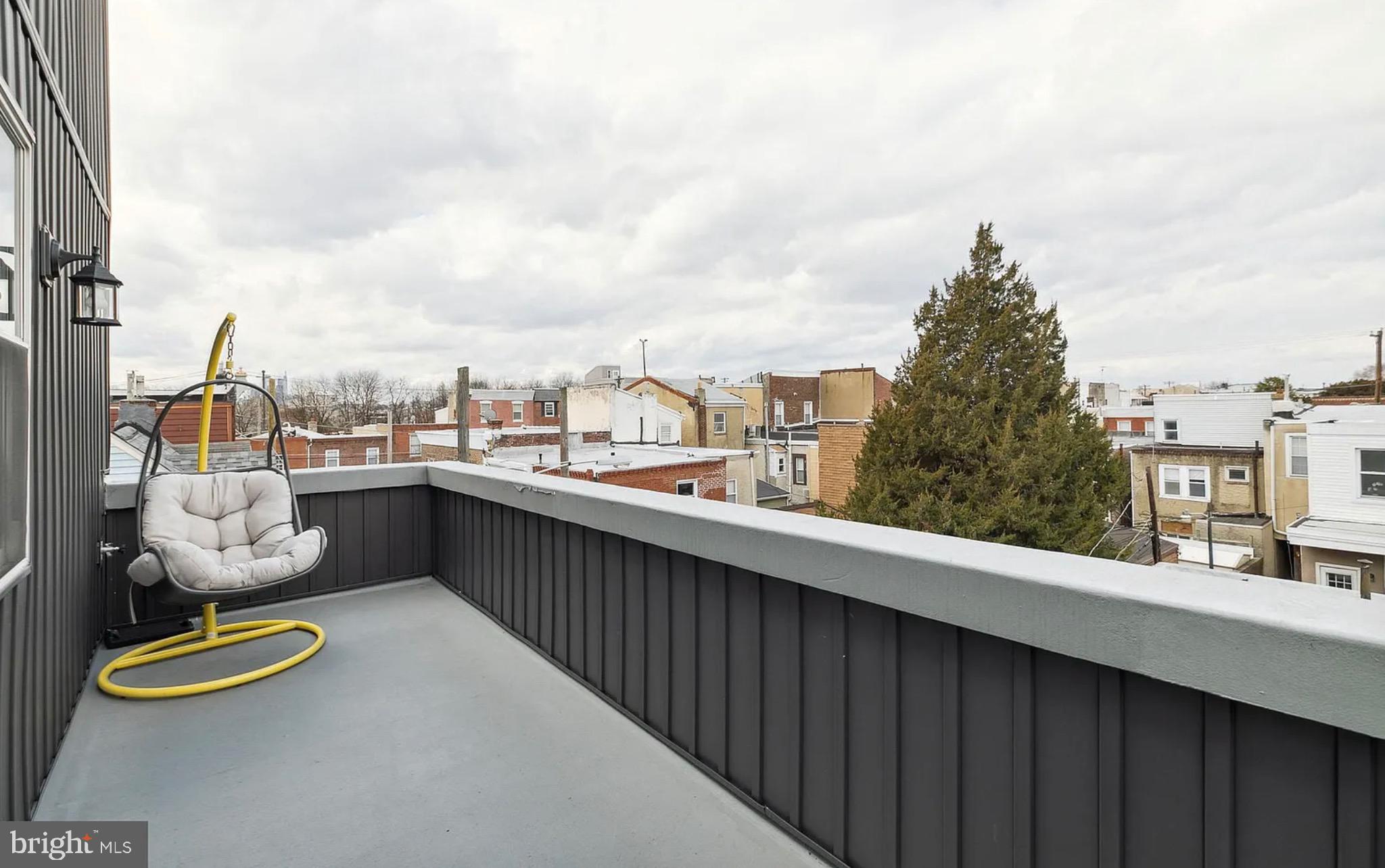 2813 Tilton Street Philadelphia, PA 19134 - Photo 22 of 33 a city view from a balcony with outdoor seating
