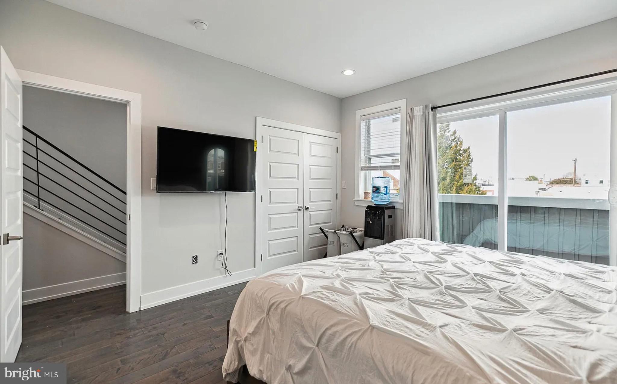 2813 Tilton Street Philadelphia, PA 19134 - Photo 24 of 33 a bedroom with a bed and a flat screen tv