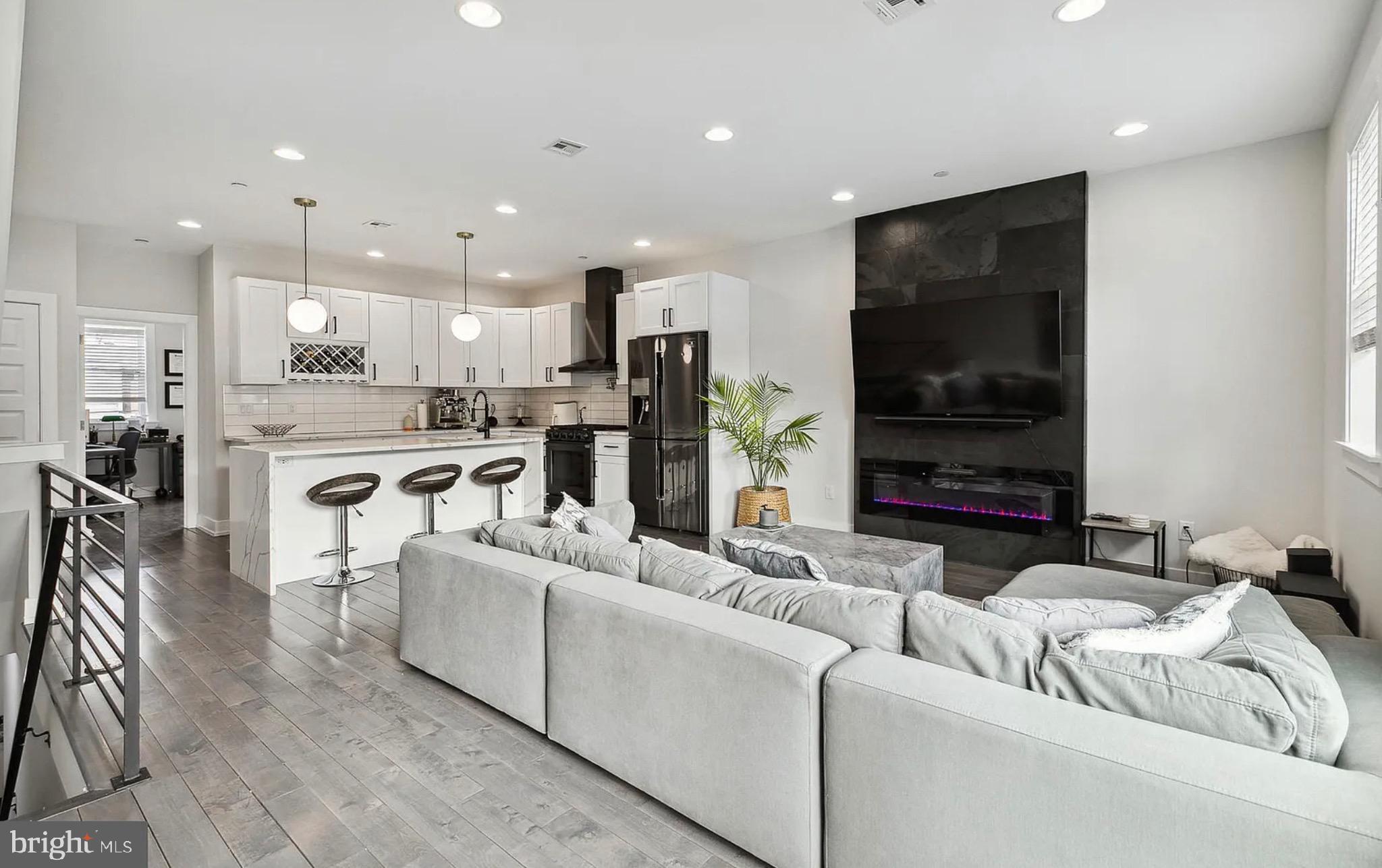 2813 Tilton Street Philadelphia, PA 19134 - Photo 4 of 33 a living room with furniture and a view of kitchen