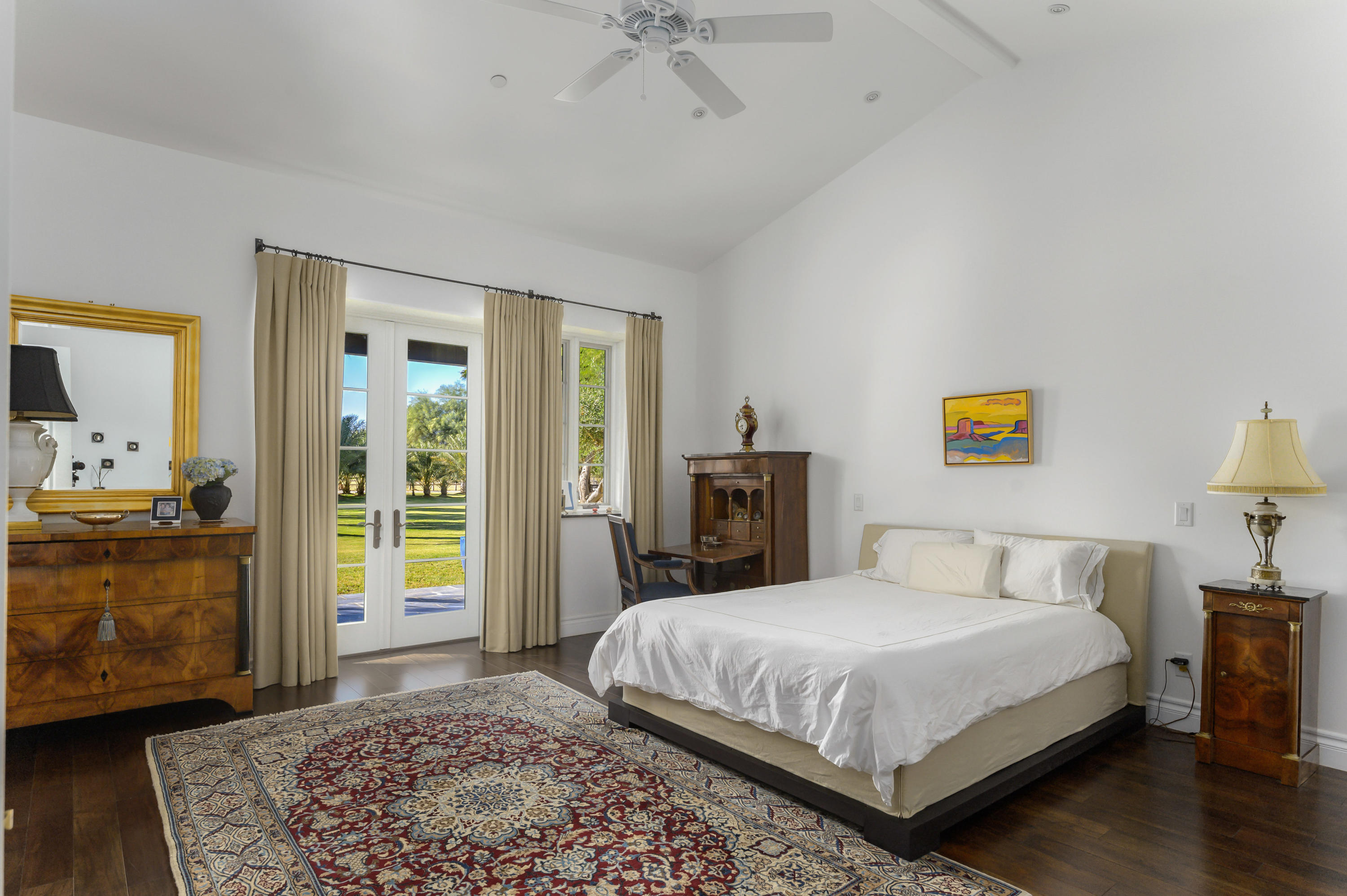 82425 Ave 55 Thermal, CA 92274 - Photo 24 of 46 a bedroom with a bed and a chandelier