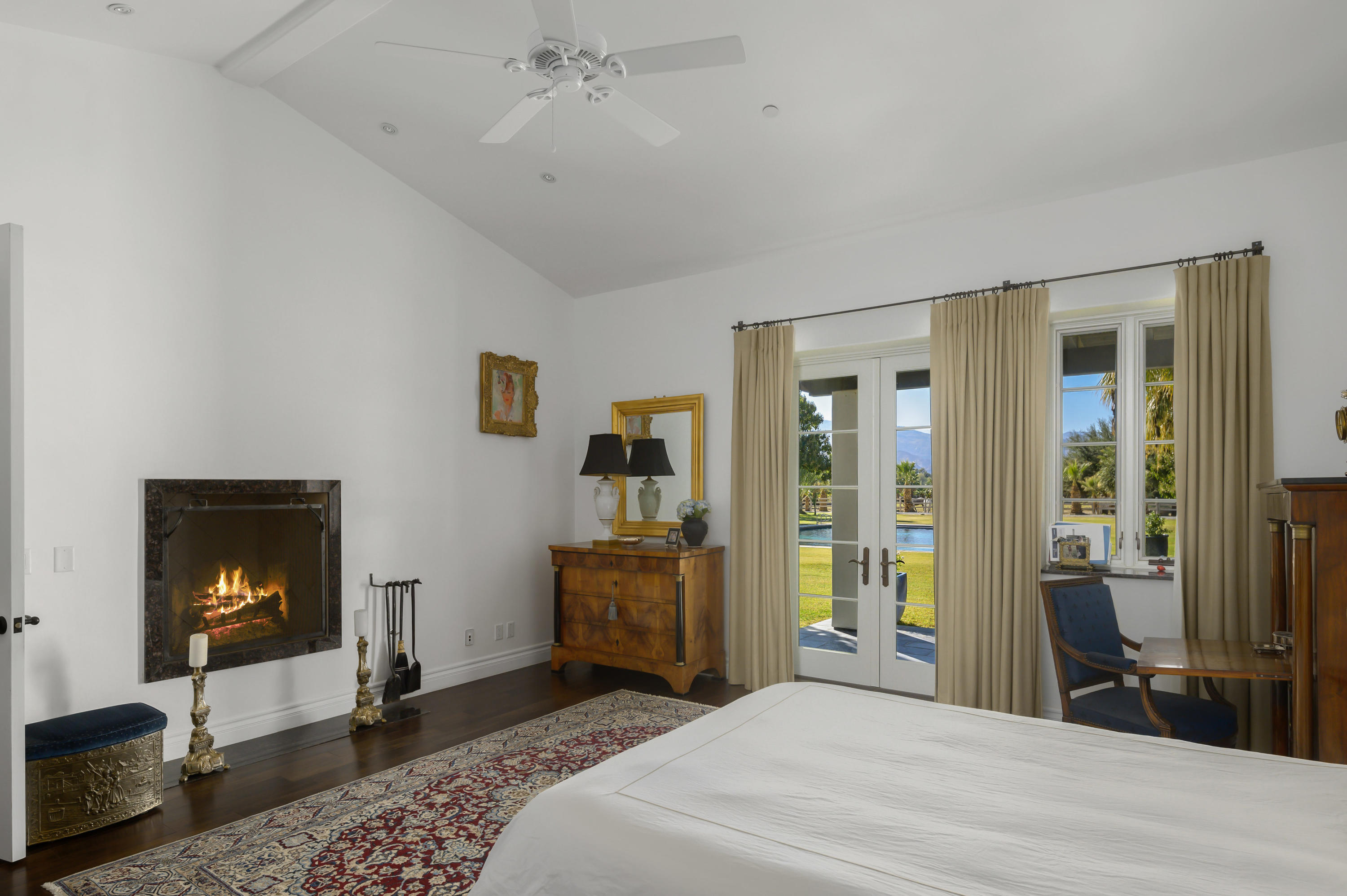 82425 Ave 55 Thermal, CA 92274 - Photo 25 of 46 a bedroom with a bed and wooden floor