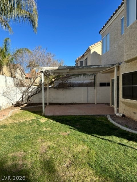 2152 Falcon Pointe Lane Henderson, NV 89074 - Photo 3 of 11 Fenced backyard with a patio