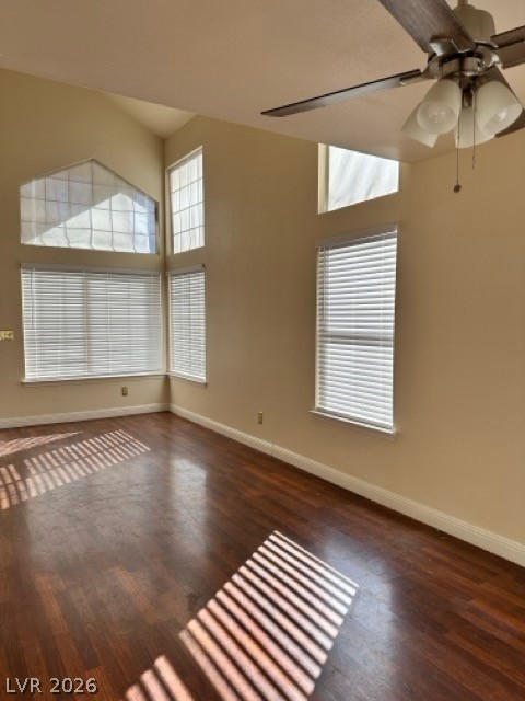 2152 Falcon Pointe Lane Henderson, NV 89074 - Photo 5 of 11 Spare room with dark wood finished floors, plenty of natural light, and a ceiling fan