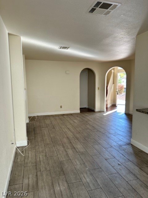 2152 Falcon Pointe Lane Henderson, NV 89074 - Photo 7 of 11 Unfurnished room with arched walkways and wood tiled floors
