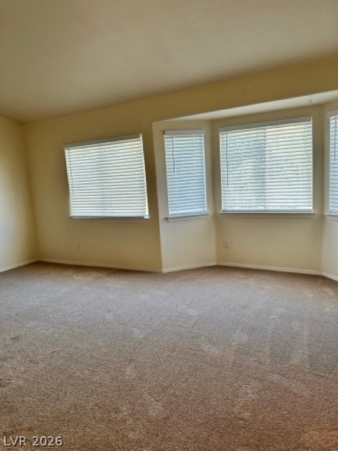 2152 Falcon Pointe Lane Henderson, NV 89074 - Photo 10 of 11 Carpeted empty room with baseboards