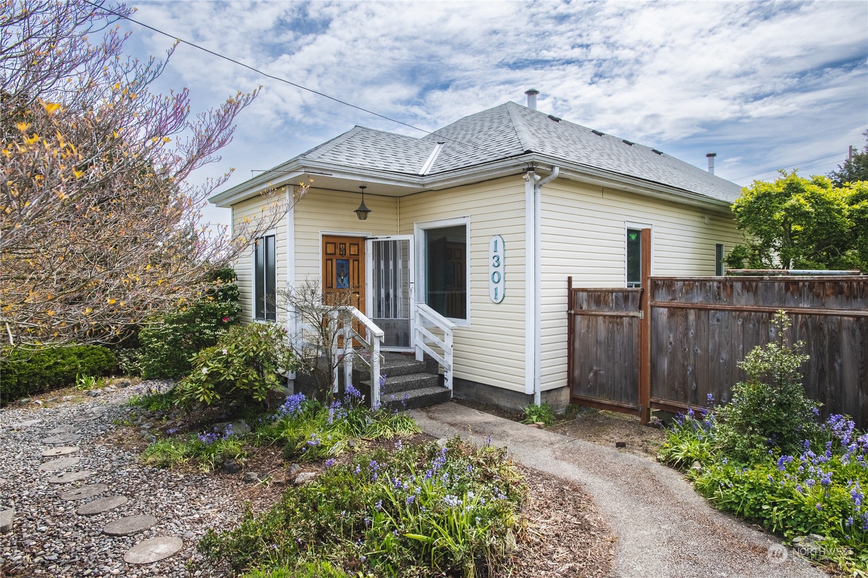 a front view of a house with garden