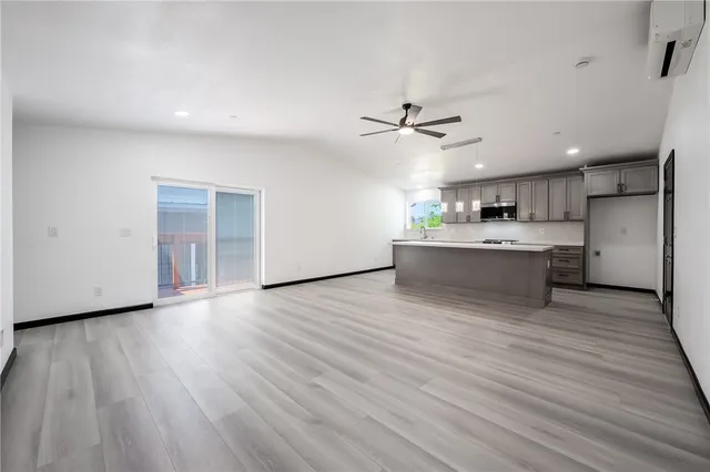 a view of a kitchen with a sink and a stove top oven