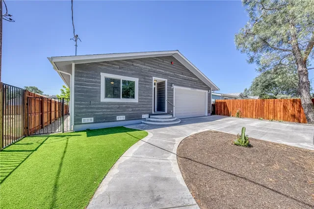a backyard of a house with yard and trees