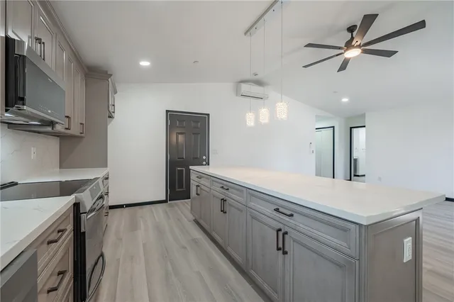 a spacious bathroom with a sink a vanity and a mirror