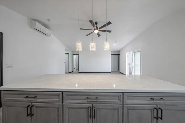 a view of a kitchen with a sink and cabinets