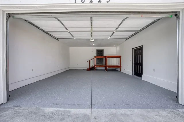 a view of a livingroom with furniture and a window