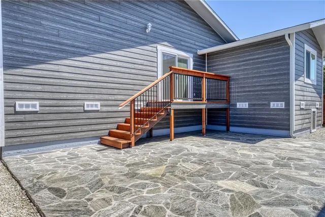 a view of a house with wooden fence