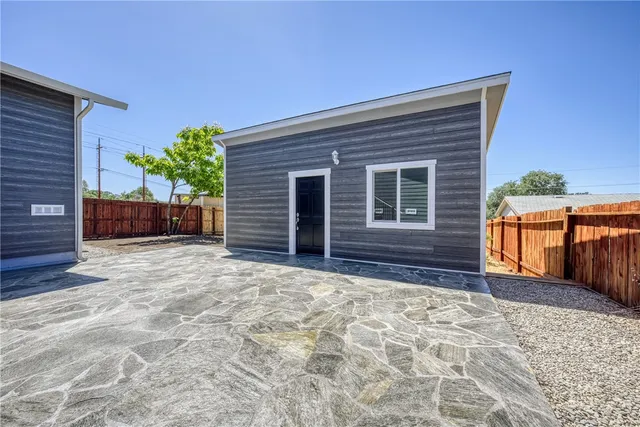 a view of house with backyard and garden