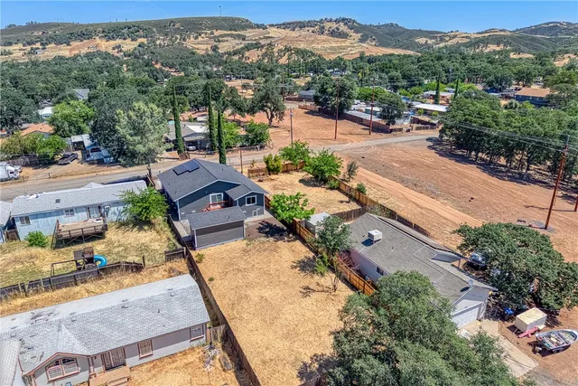 an aerial view of a house with a garden