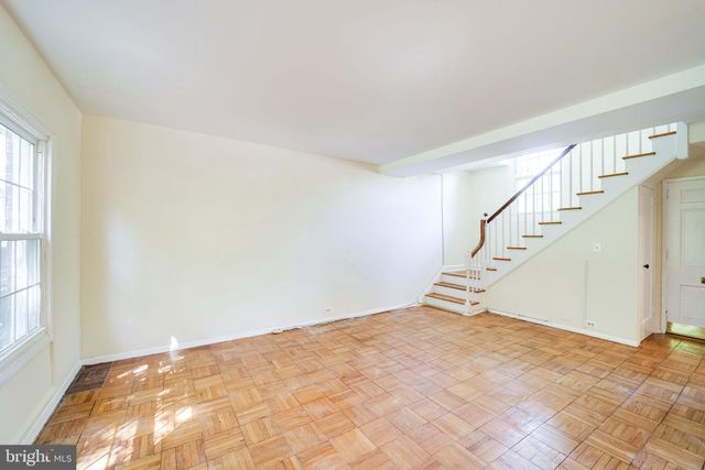 a view of empty room with stairs