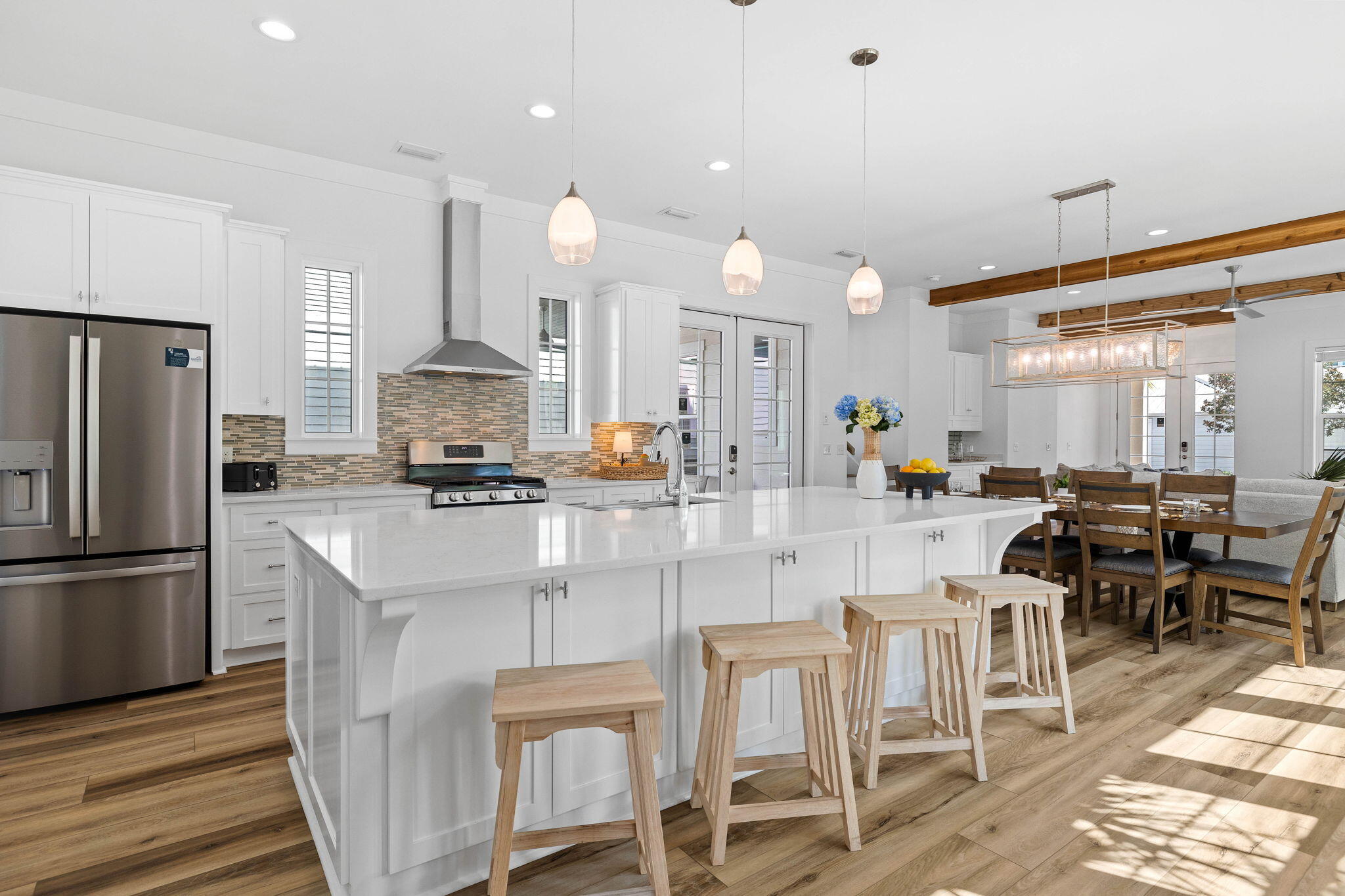 342 Beach Bike Way Inlet Beach Inlet Beach, FL 32461 - Photo 15 of 86 a kitchen with stainless steel appliances kitchen island granite countertop a table chairs and a refrigerator