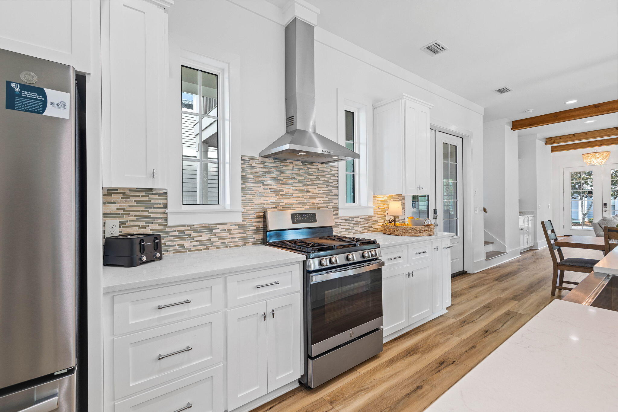 342 Beach Bike Way Inlet Beach Inlet Beach, FL 32461 - Photo 17 of 86 a kitchen with stainless steel appliances white cabinets and a stove