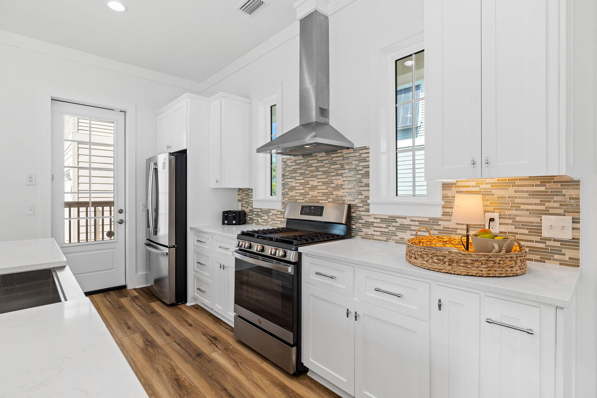 342 Beach Bike Way Inlet Beach Inlet Beach, FL 32461 - Photo 20 of 86 a kitchen with stainless steel appliances a stove a refrigerator and a sink