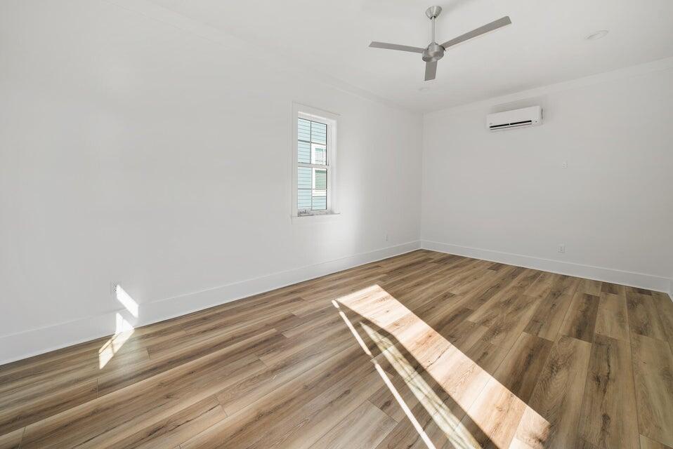342 Beach Bike Way Inlet Beach Inlet Beach, FL 32461 - Photo 60 of 86 a view of a room with wooden floor and fan