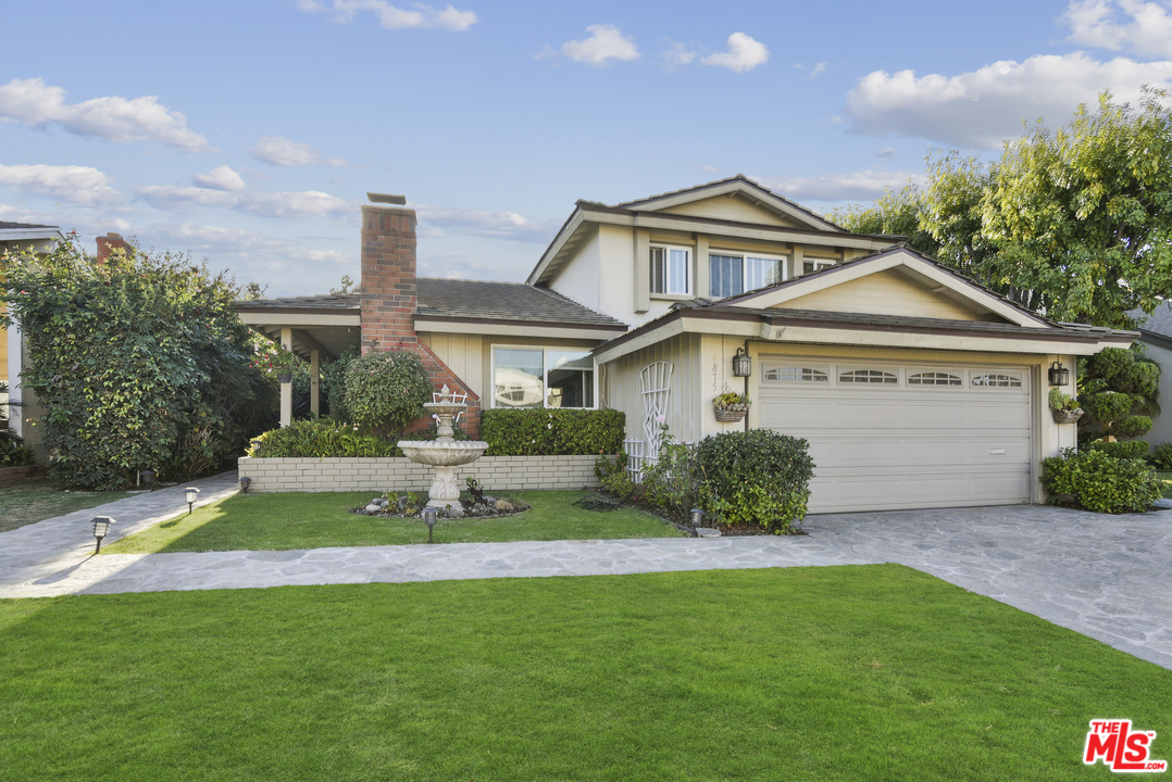 4875 Patrae Street Los Angeles, CA 90066 - Photo 2 of 23 a front view of a house with a yard