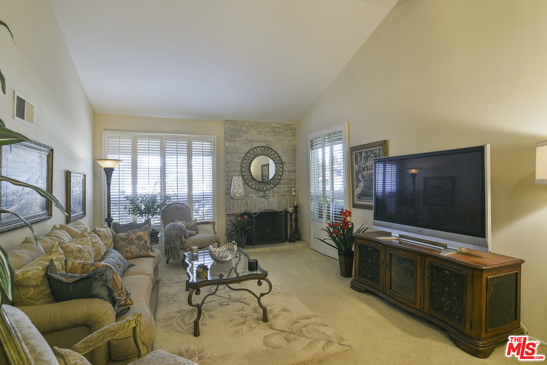 4875 Patrae Street Los Angeles, CA 90066 - Photo 5 of 23 a living room with furniture and a flat screen tv