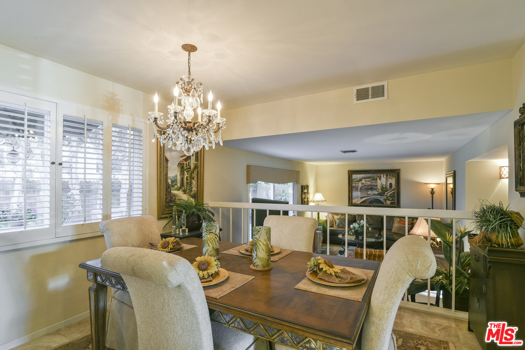 4875 Patrae Street Los Angeles, CA 90066 - Photo 7 of 23 a view of a dining room with furniture and a chandelier