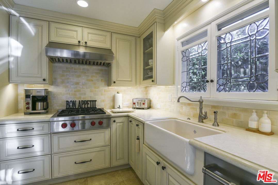 4875 Patrae Street Los Angeles, CA 90066 - Photo 9 of 23 a kitchen with a sink and a stove