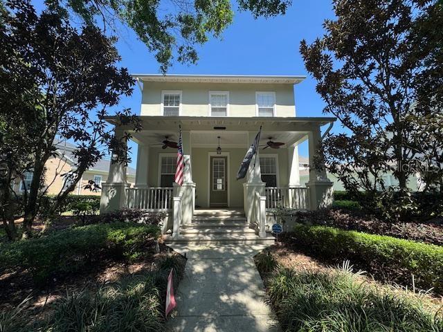 1442 Stickley Avenue Celebration, FL 34747 - Photo 1 of 46 front view of a house with a tree