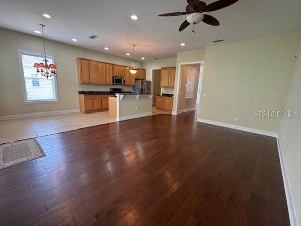 1442 Stickley Avenue Celebration, FL 34747 - Photo 12 of 46 a view of kitchen with cabinets and wooden floor