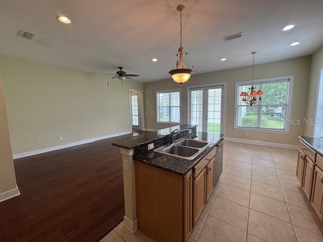 1442 Stickley Avenue Celebration, FL 34747 - Photo 16 of 46 a kitchen that has a sink and a stove